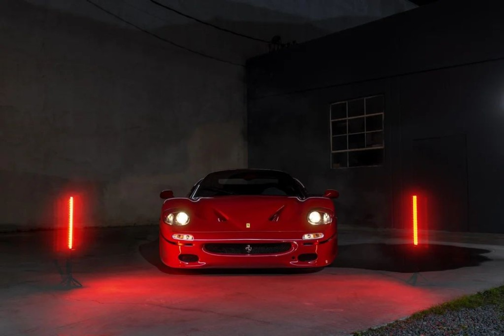 Ferrari F50 in a dark, atmospheric setting